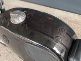 a close up of a motorcycle with a speaker on it