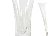 two wine glasses sitting next to each other on a table