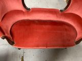 a red chair that is sitting in a room
