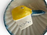 a small piece of cake on a plate with a spoon