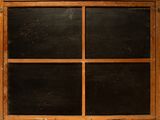 an old window with a wooden frame and glass panes