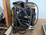 a picture of a welder in a garage