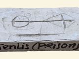 a cement block with writing on it that says jerry ' s prison
