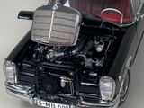 an image of a black car with the hood up