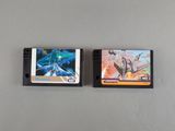 two nintendo game cartridges sitting side by side on a table