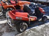 a red scooter parked in a parking lot next to other scooters