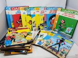 a bunch of comics are stacked on top of each other