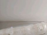 a roll of toilet paper wrapped in plastic on a table