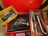 many tools in a red box on the floor