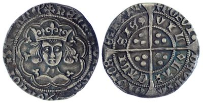 une pièce d'argent surmontée d'une couronne