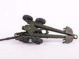 a toy army vehicle with wheels on a white surface