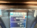 a picture of a parking meter with a clock on it