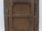 an old wooden picture frame with a square hole in the middle