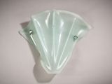 a glass wall sconce on a white wall