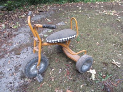 a small tricycle that is sitting on the ground
