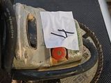 a machine that is sitting on top of a luggage bag