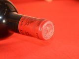 a bottle of wine that is sitting on a table