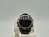 an image of a ring with a black stone on a stand