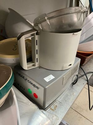 a blender sitting on top of a counter next to a bowl