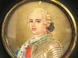 painting of a man in a military uniform in a black frame