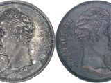 a close up of a coin with a woman ' s head on it