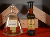 two bottles of liquor sitting next to each other on a table