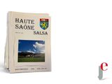 a picture of a book with a picture of a town on it