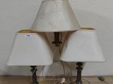 two lamps that are sitting on the floor next to each other