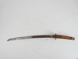 a close up of a knife with a wooden handle on a white surface