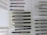 many different types of pens in a plastic container