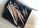 a box with a bunch of wooden knitting needles in it