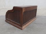 a wooden box that is sitting on the ground