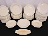 a lot of plates that are sitting on a table