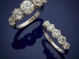 a pair of diamond and platinum - plated rings