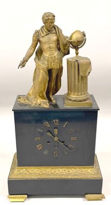 a statue of a man holding a globe and a clock