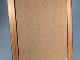 an old picture frame with a piece of cardboard in it