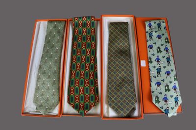 three ties in a box with a tie in the middle of them