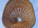 an image of a wicker chair sitting on top of a white sheet