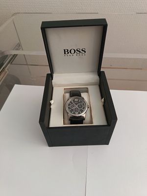 boss watch in a black box on a white table
