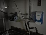 a sink with a faucet and a water dispenser in it