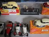 a lot of toy cars that are sitting on a table