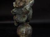 an image of a statue of a boy on top of a ball