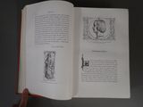 someone is holding a book open to a page with a picture of a man