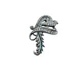 a close up of a brooch with diamonds on a white background