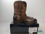 a close up of a pair of brown boots on top of a box