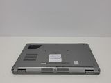 a laptop that is sitting on a white table