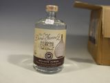 a bottle of liquor sitting next to a cardboard box