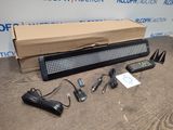 a box with a keyboard, remote, and other electronics on it