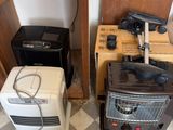 two toasters and a toaster on the floor in a room