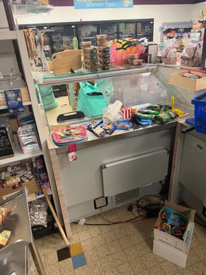 a counter in a store with a lot of food on it